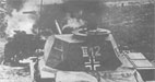 Легкий Pz II на фоне горящего советского танка. Июньские бои 1941 г.